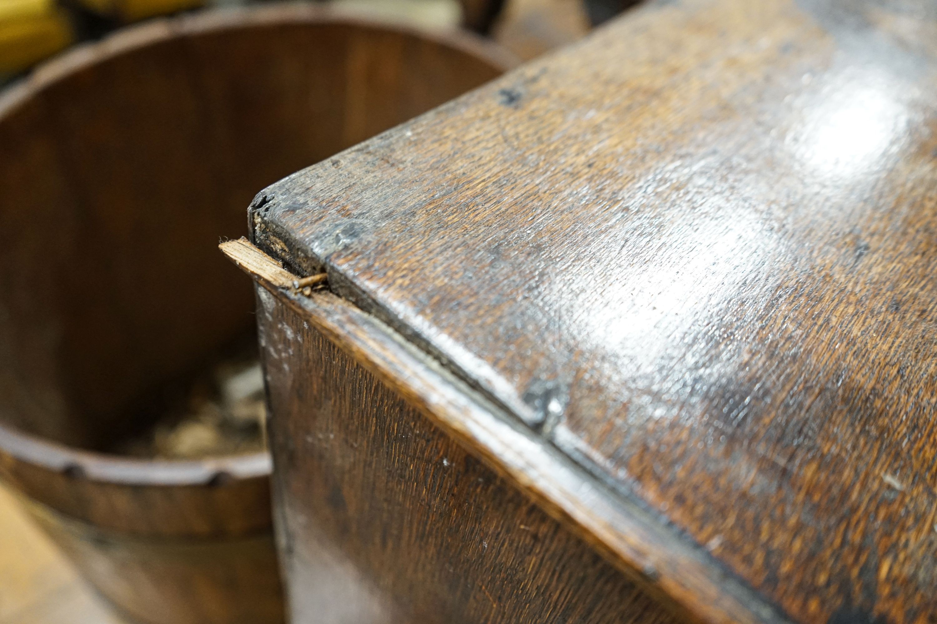 A late 17th century oak spice cupboard, with geometric panelled door enclosing five small drawers, on later stand, width 43cm, depth 27cm, height 67cm